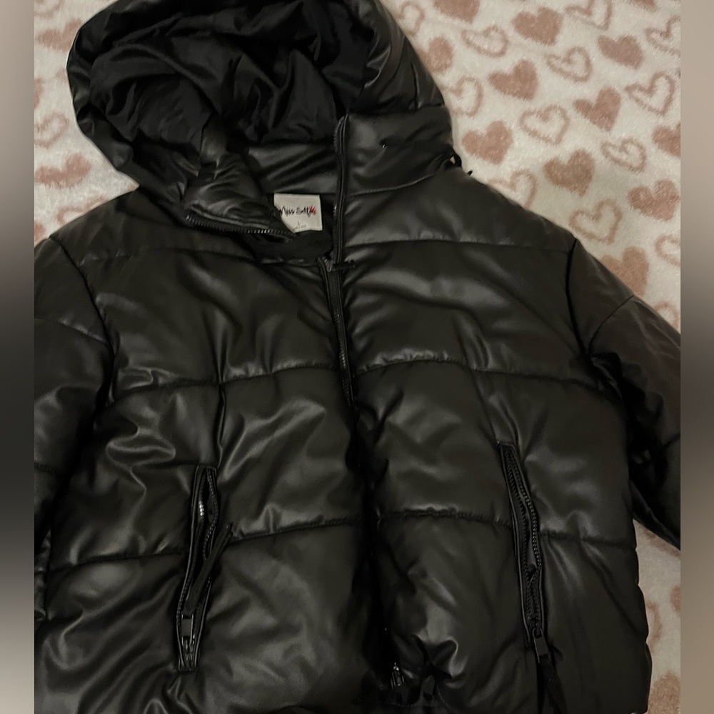 A black oversized puffer from the brand miss selfie